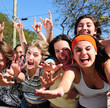 teenage fans screaming and reaching out for a celebrity