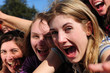 teenage fans screaming and reaching out for a celebrity