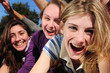 teenage fans screaming and reaching out for a celebrity