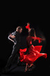 Photo: dancer in action against black background dancer in action against black background