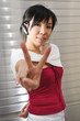 Beautiful Young Asian Woman With Bluetooth Earpiece