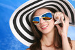 woman listens seashell