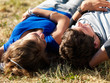 Foto: Young couple relaxing at meadow Young couple relaxing at meadow