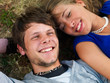 Happy young couple relaxing outdoors
