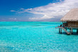 bungalow over beautiful turquoise waters in tahiti
