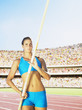 Athlete pole vaulting in an arena