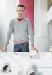 Architect with drafts in office