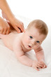 The feminine hands massage the cute baby boy