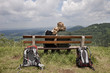 young couple take a break at a hiking tour