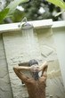 Woman using outdoor shower