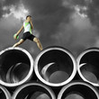 Discus thrower on top of large cylinders