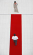 Aerial view of businesswoman and man with red carpet