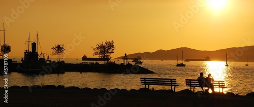 Silhouette of a couple enjoy beautiful sunset view