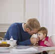 Father Feeding Daughter Breakfast