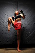 Asian Woman Practicing Muay Thai Boxing In Underground Tunnel