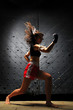 Asian Woman Practicing Muay Thai Boxing In Underground Tunnel