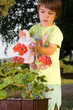 Child watering flowers