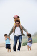 Happy young father and three kids having fun