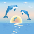 Jumping dolphins in front of a sunset over sea Jumping dolphins in front of a sunset over sea