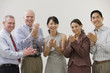 Diversity in team members cheering success.