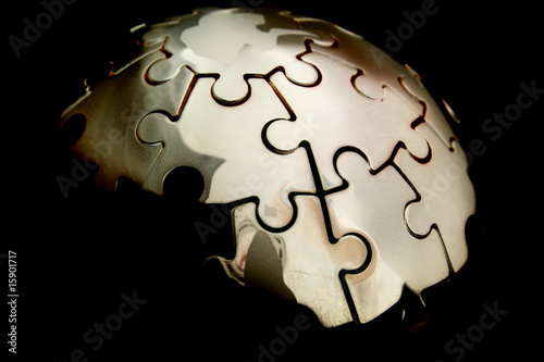Photo: Earth jigsaw on black background Earth jigsaw on black background