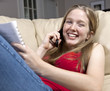 Girl Studying While Chatting on Cell Phone