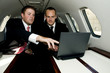 Businessmen working on a corporate jet