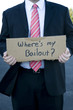 Businessman holding a sign
