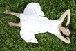 Young smiling girl relaxing in grass