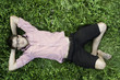 Young man relaxing in grass Young man relaxing in grass
