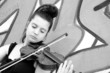 portrait of a pretty young woman playing the violin