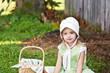 Little Amish girl gathering eggs
