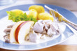 Matjes herring on plate with side dishes
