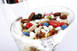 Pills in cocktail glass, close-up