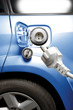 Electric plug and electric car, close-up