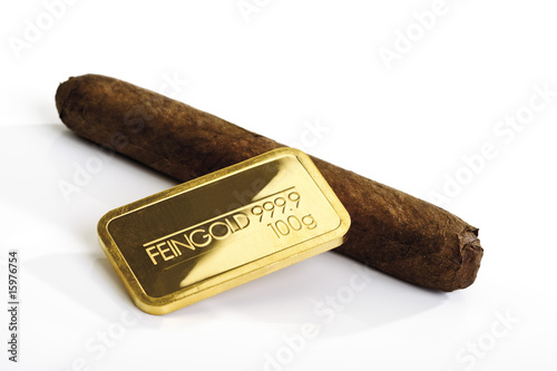 Photo: Gold bar and cigar Gold bar and cigar