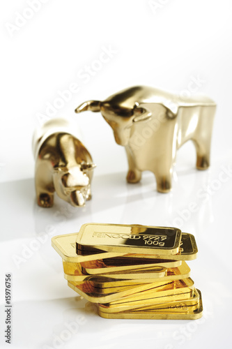 Photo: Bull and bear sculptures by gold bars Bull and bear sculptures by gold bars