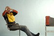 Photo: Man sitting in front of TV with head in hands Man sitting in front of TV with head in hands