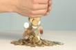 Coins falling from hands
