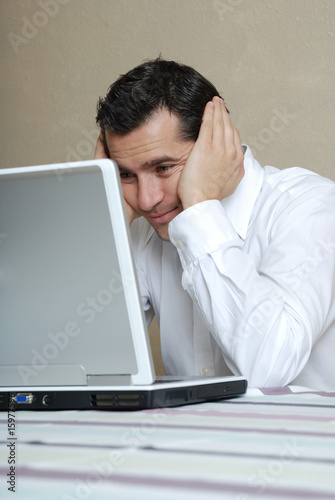 Photo: Young man with laptop, portrait Young man with laptop, portrait