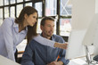 Business people in office using computer