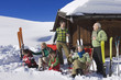 Italy, South Tyrol, Seiseralm, Family in front of log cabin
