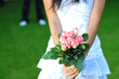 A Lady Holding A Bouquet Of Pink Roses A Lady Holding A Bouquet Of Pink Roses