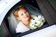 portrait of the bride in the wedding car