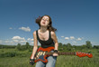 Playful sneering teenage girl with red electric guitar Playful sneering teenage girl with red electric guitar