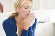 Close-up of a woman coughing