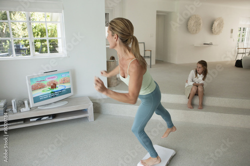 Free Online Step Aerobics Videos on Woman Doing Step Aerobics And Watching Tv    Onoky  16009784   See