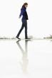 Woman walking at the poolside