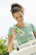 Woman seasoning salad