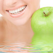 healthy teeth and green apple